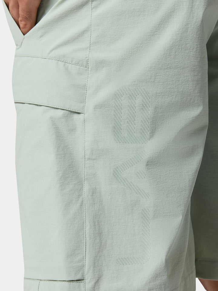 A close view of the side pocket and the cargo pocket, with its tonal print, on the Urban Explorer Water-Repellent Casual Shorts in Sage Gray