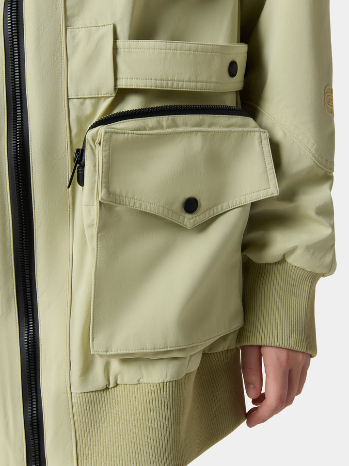 The flap cargo pocket and ribbed cuff of the UtiliCore 3D Pocket Shell Jacket in Celadon Green