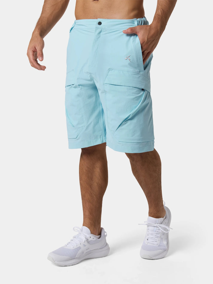 Tittallon Urban Explorer Water-Repellent Casual Shorts in Glacier Blue, a hand in the pocket, waist to feet on a pale studio ground