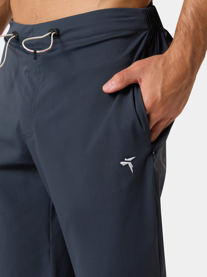 The drawcord waist and a hand in the side pocket of the Active Life Sports Performance Shorts in Obsidian Gray