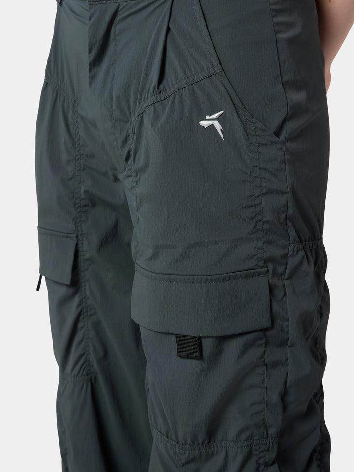 The cargo pocket on the leg of the Urban Explorer Water-Repellent Pleated Wide-Leg Pant in Obsidian Gray