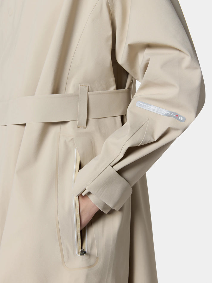 Macro of the coat belt and taped cuff in Sandstone Beige