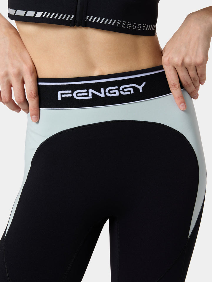 The logo waistband and contrast panel of the ResistFlex MeshContour Pant in Abyss Opal