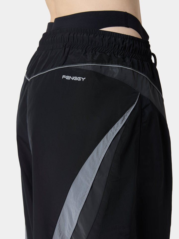 The back waistband and curved contrast panel of the CurvePanel Cargo Pant in Obsidian Black