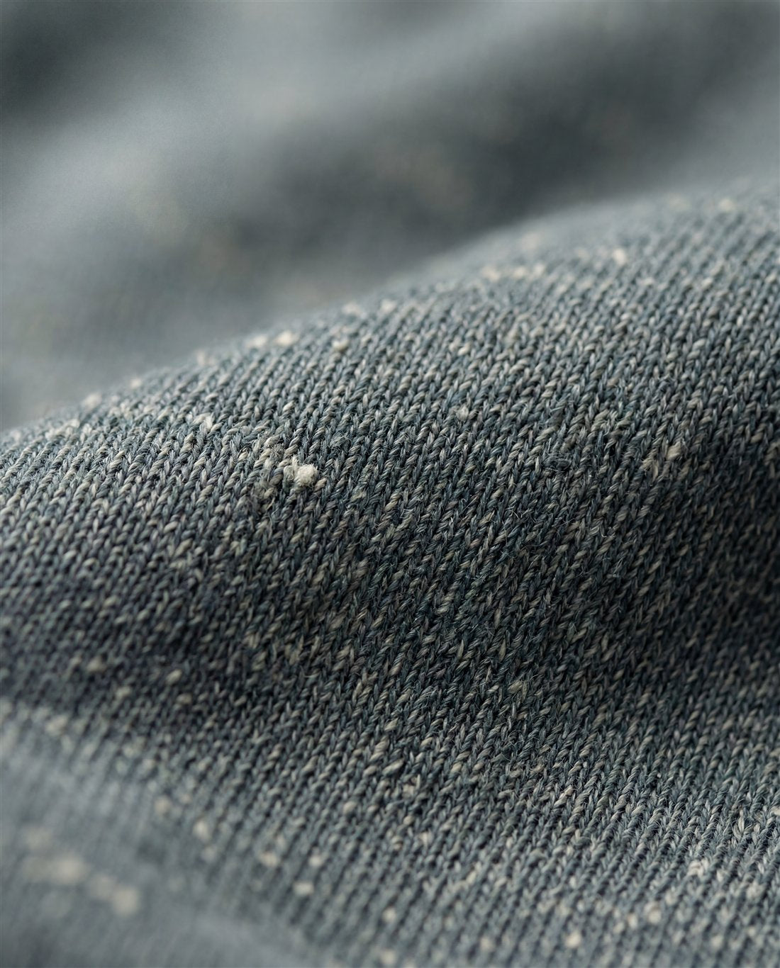 Recycled technical knit woven from reclaimed fibers