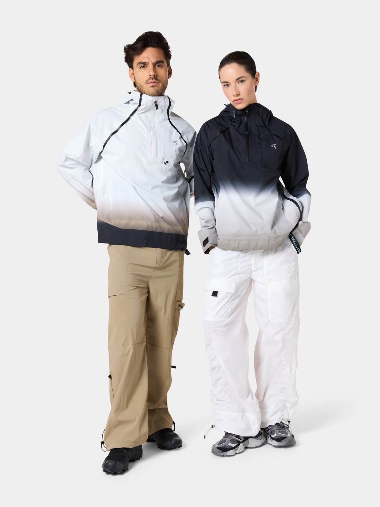 A man and a woman in the Tittallon Unisex Urban Explorer Functional Pullover, his in Dusk Gradient, hers in Eclipse Gradient, full length, front view